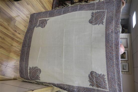 A Victorian woven silk shawl, four others and a Norwich shawl